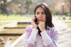 Lady looking concerned about a phone call