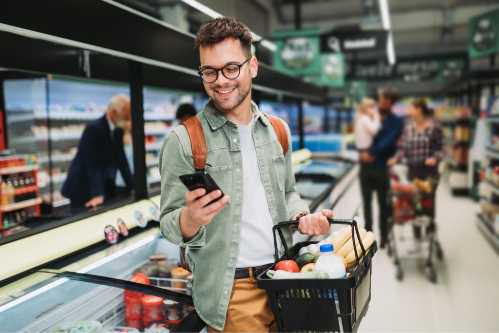 A man shopping in a supermarket.