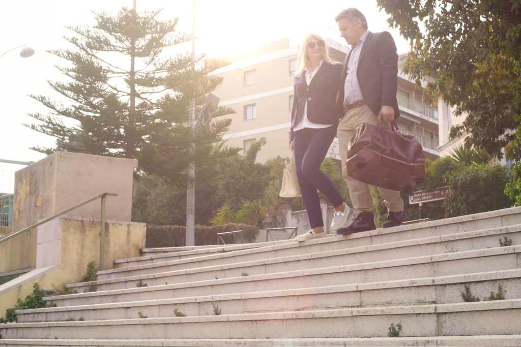 A couple walking down some steps.