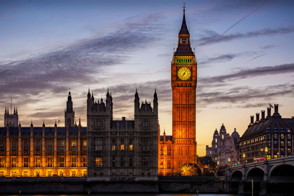 An external image of the Palace of Westminster in the evening