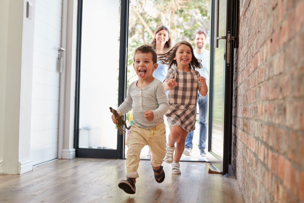 Children running through the front door.