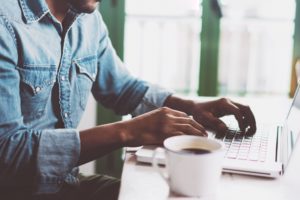 A man working from home on a laptop.