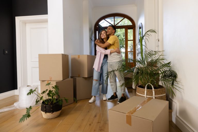 A couple moving into their new home.